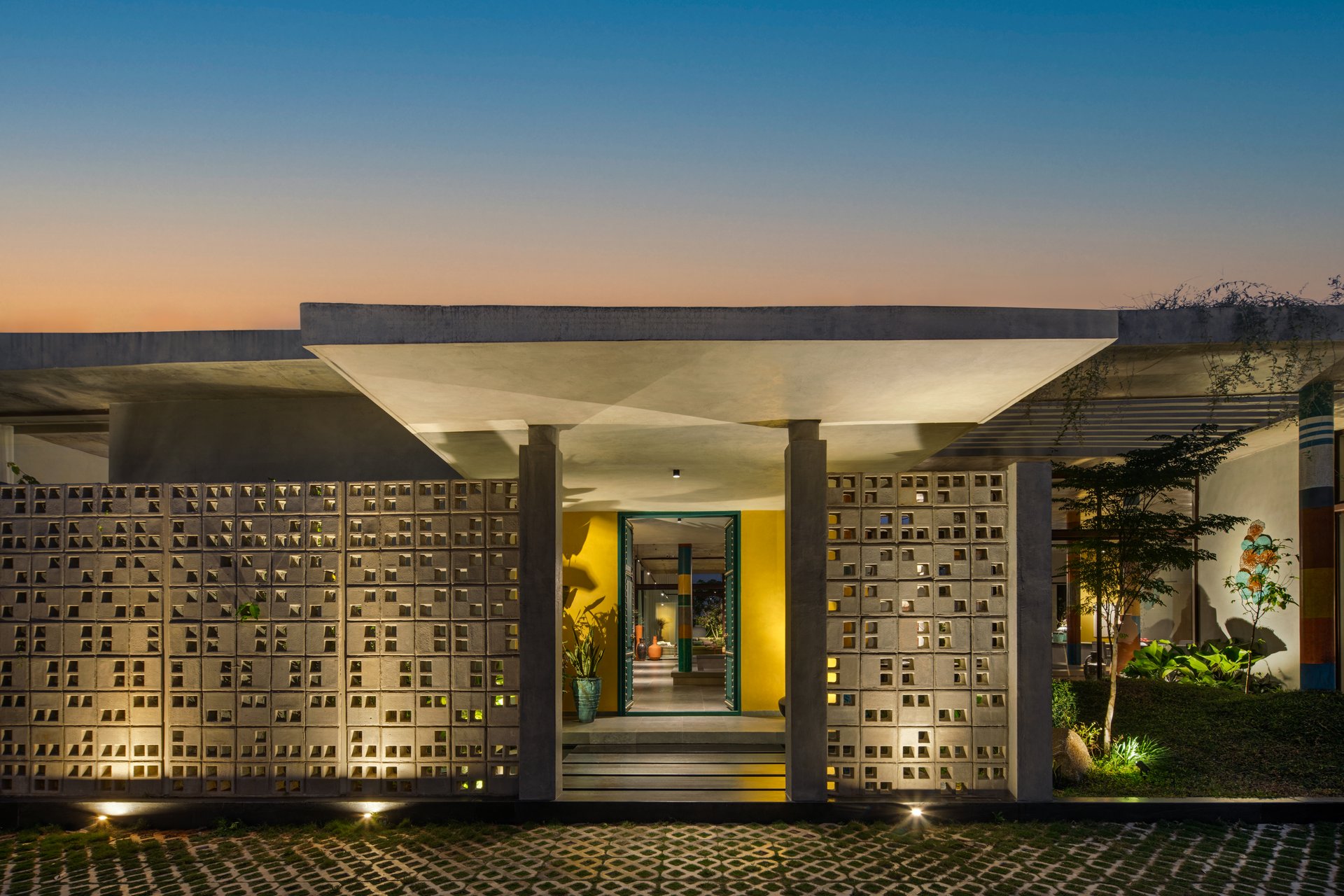 SAHN evening entrance and architectural screen with yellow door